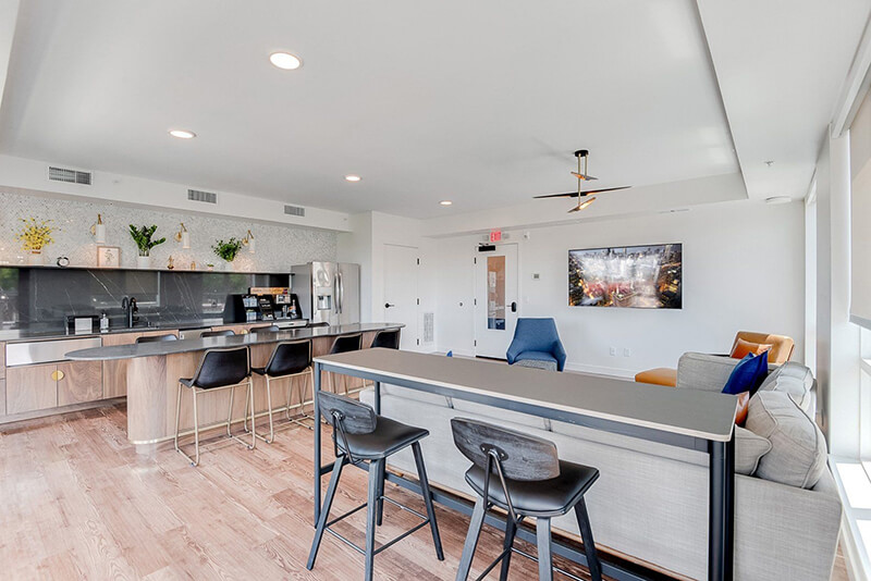 the nox apartment building community kitchen and living room