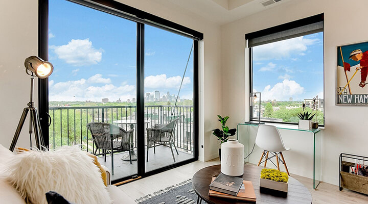 a lumos apartment living room with a view of the minneapolis skyline