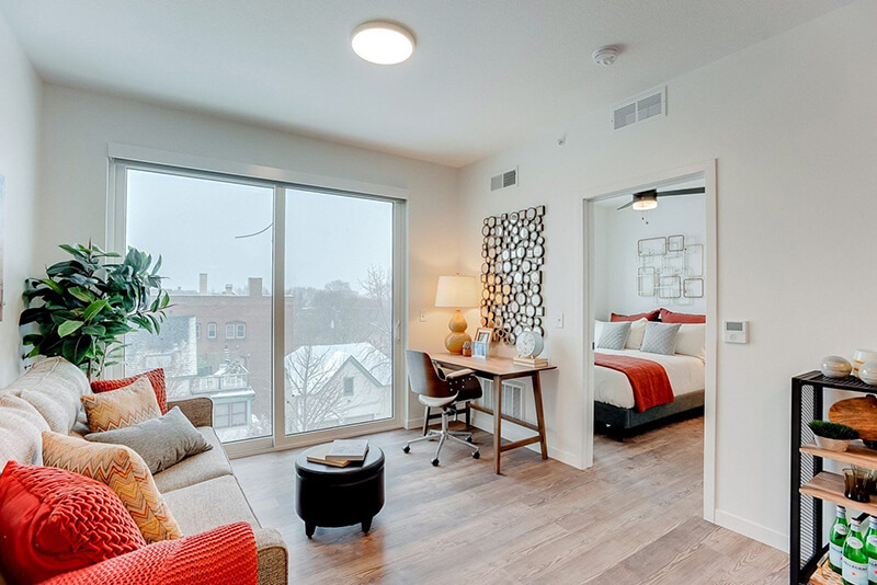 apartment living room with a view of the bedroom