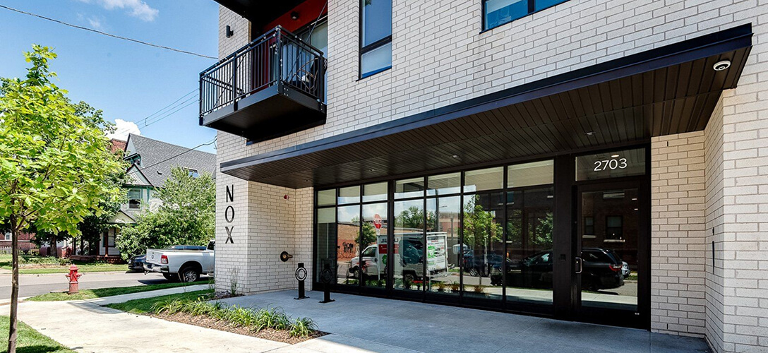 the front of the Nox Apartments building from the street